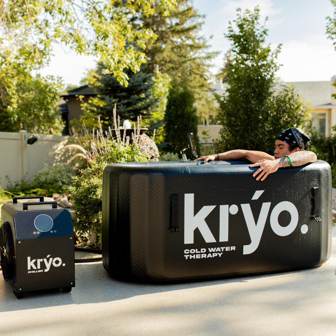 Kryo Cold Plunge and Water Chiller, front side, close up, with male sitting inside of the Cold Plunge Tub